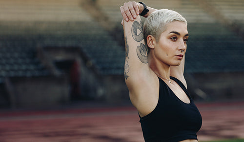 Close up of a female athlete doing warm up exercises