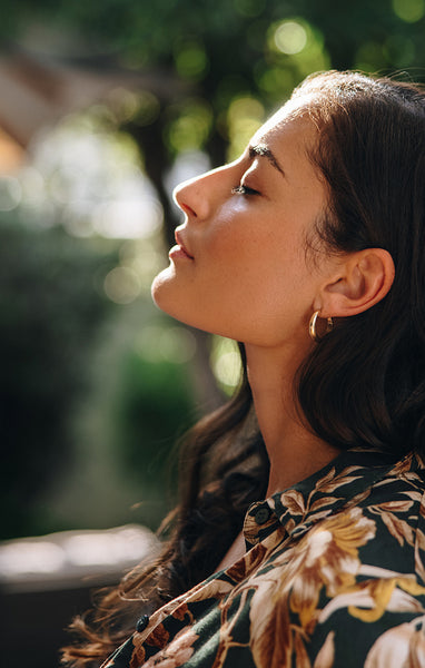 Beautiful young woman with her eyes closed