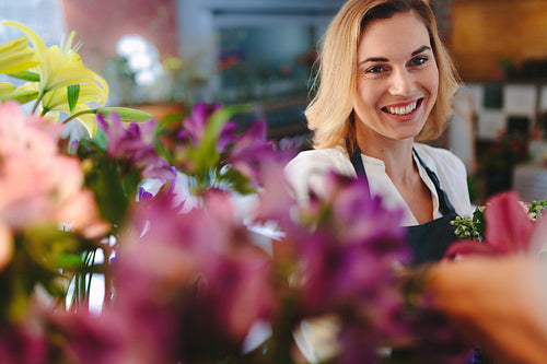 Smiling florist working in her shop.