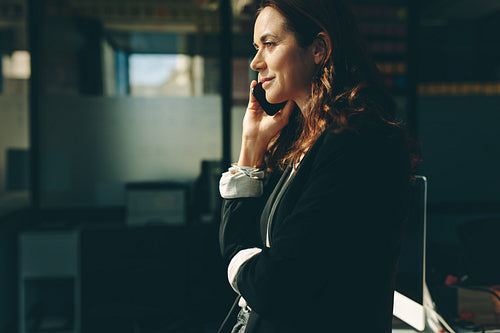 Female executive talking on cell phone