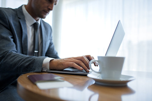 Businessman using laptop computer in office