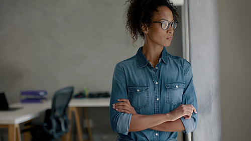 Businesswoman standing in a small office