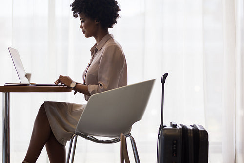 Female business traveler waiting for flight