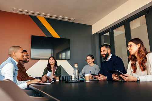 Cheerful businesspeople having a meeting in a boardroom