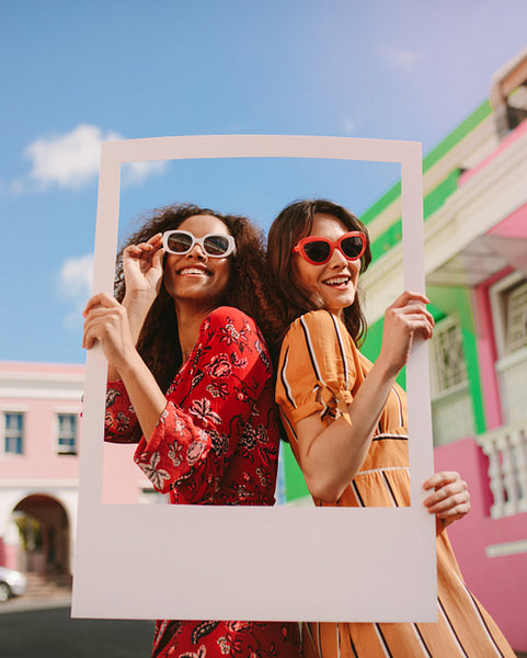 Beautiful women holding a blank photo frame