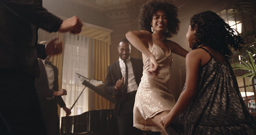 Mother and daughter enjoying dancing at gala night