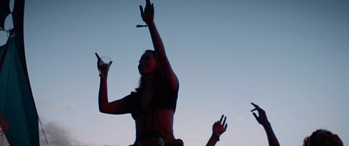 Silhouette of friends dancing at a concert
