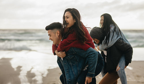 Piggyback race on the beach