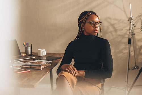Young photographer looking away thoughtfully