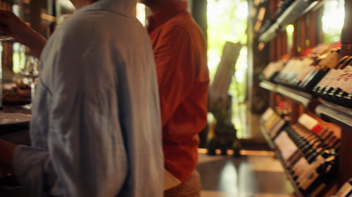 Friends toasting and savoring red wine in a private cellar tasting experience