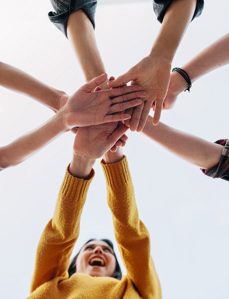 Friends stacking hands - showing friendship