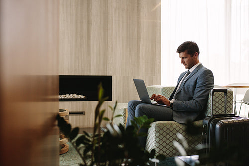 Executive in airport business lounge waiting for flight