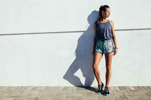 Female runner standing outdoors