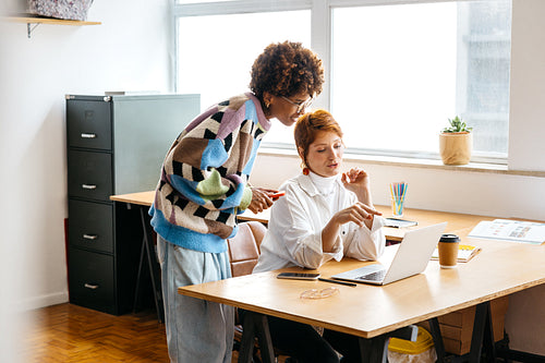 Colleagues collaborating in a modern freelance office space