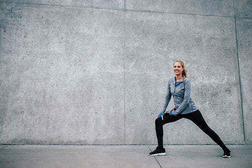 Female runner stretching after running session
