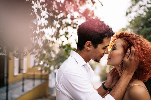 Young couple in a romantic mood out in the street.