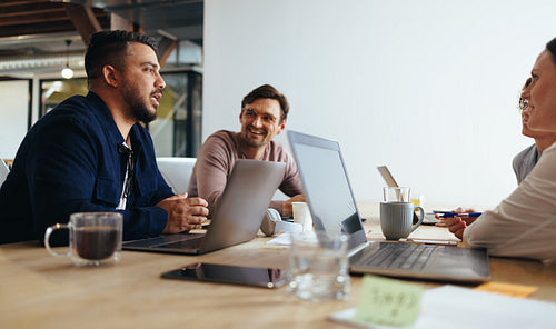 Marketing professionals having a discussion in a meeting