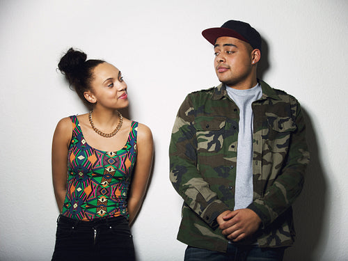 Young couple looking at each other with attitude