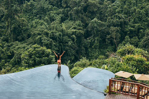 Woman enjoying vacation at luxury resort