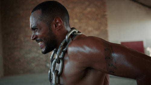 Muscular man doing triceps dip exercises