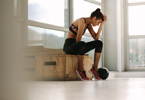 Fitness woman feeling tired after workout