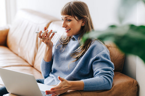 Cheerful businesswoman having a phone call discussion in a modern office