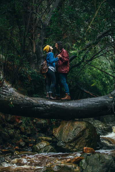 Couple enjoying in rain at the forest