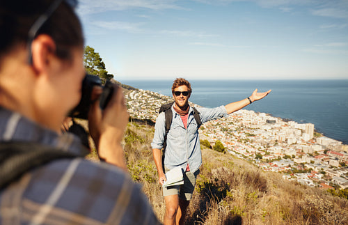 Tourist couple enjoying nature and taking photo