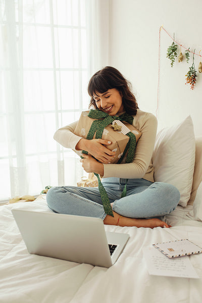 Woman embracing  her christmas present