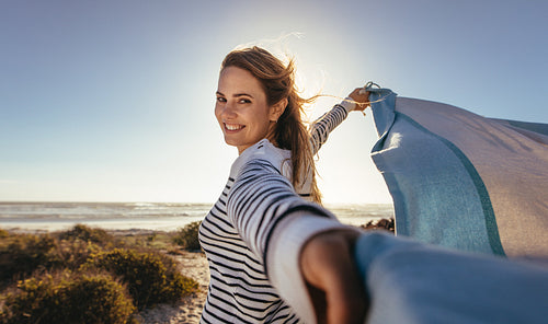 Close up of a woman standing at the sea shore