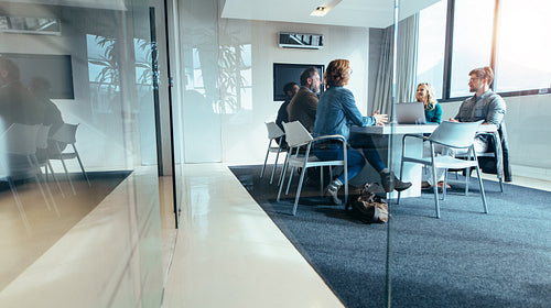 Group of business people having discussion in conference room