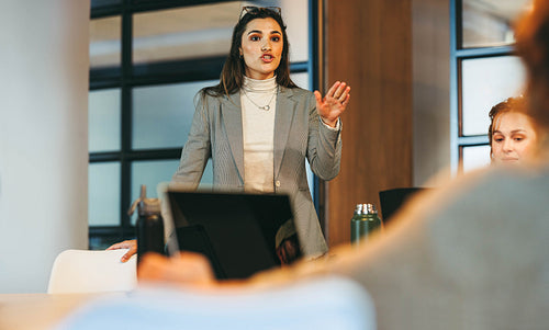 Business professionals collaborating on creative ideas in a professional office setting