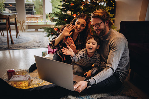 Family having a video call during christmas.