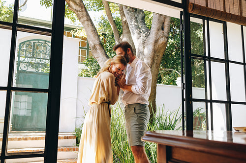 Couple laughing together outside a hotel entrance
