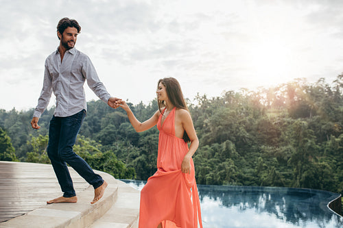 Young couple near swimming pool