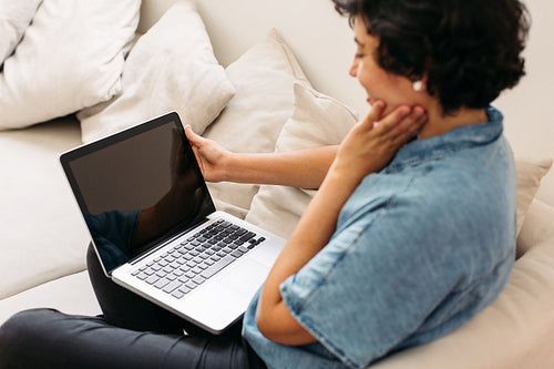 Woman with laptop at home
