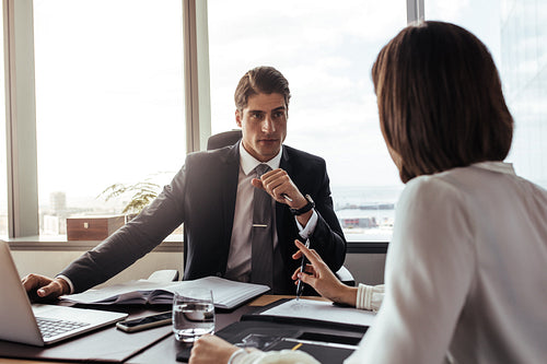Businessman listening to the suggestions from colleague