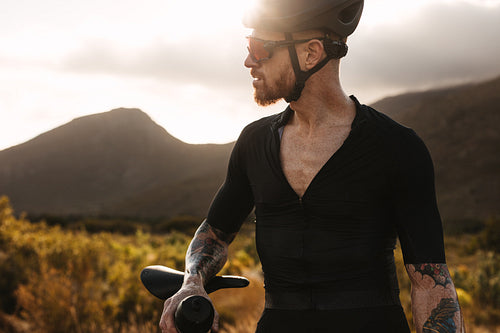 Male cyclist taking a break