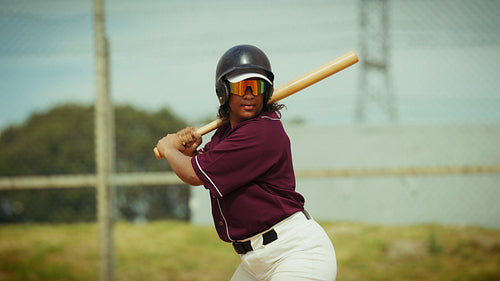 Focused batter swings the bat with power and precision