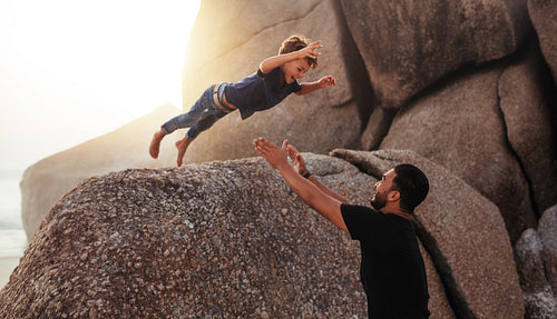 Father and son enjoying summer holidays at the beach