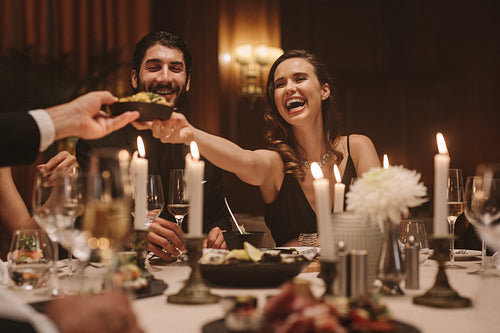 Group of friends at gala dinner party