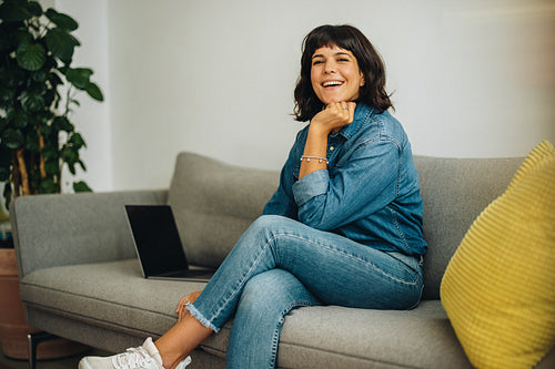 Cheerful freelancer in office lobby