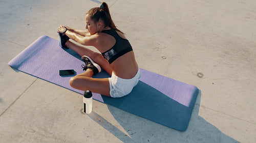 Woman doing warm up exercise