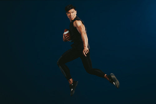 American footballer practicing tackle