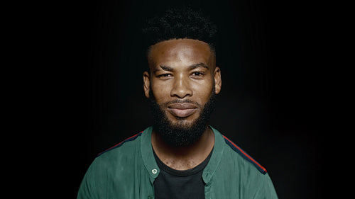 African man with beard smiling