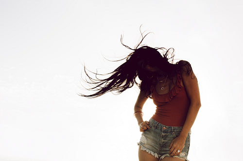 Carefree woman dancing outdoors