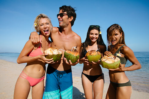 Young man and women having fun on the beach