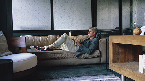 Mature businessman having a video chat in break