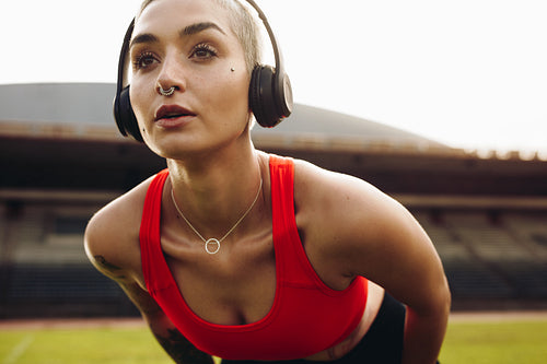Close up of a woman athlete training wearing headphones
