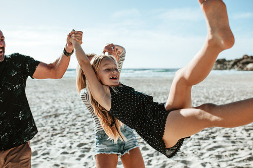 Playful family on the beach